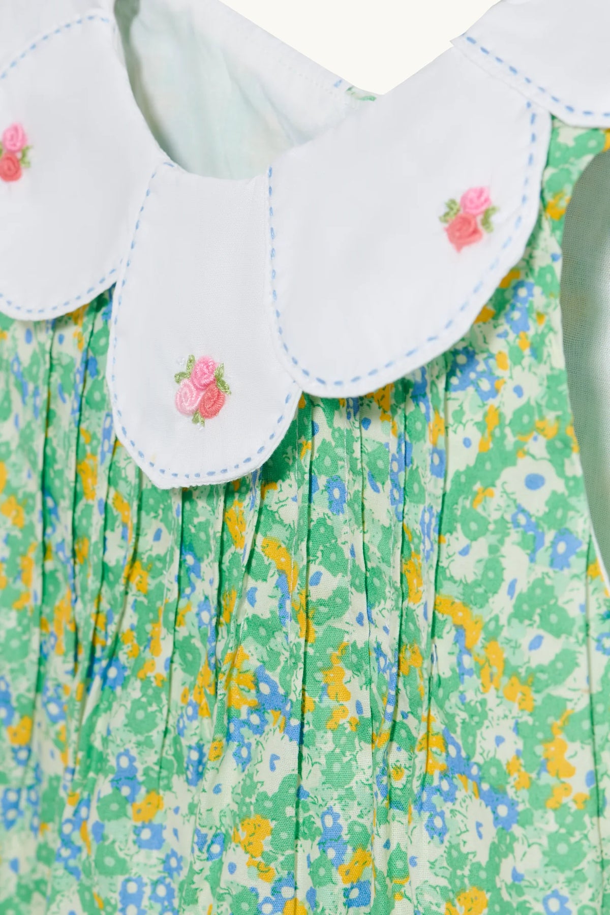 Rosette romper in Sage Green hand-embroidered cotton lawn