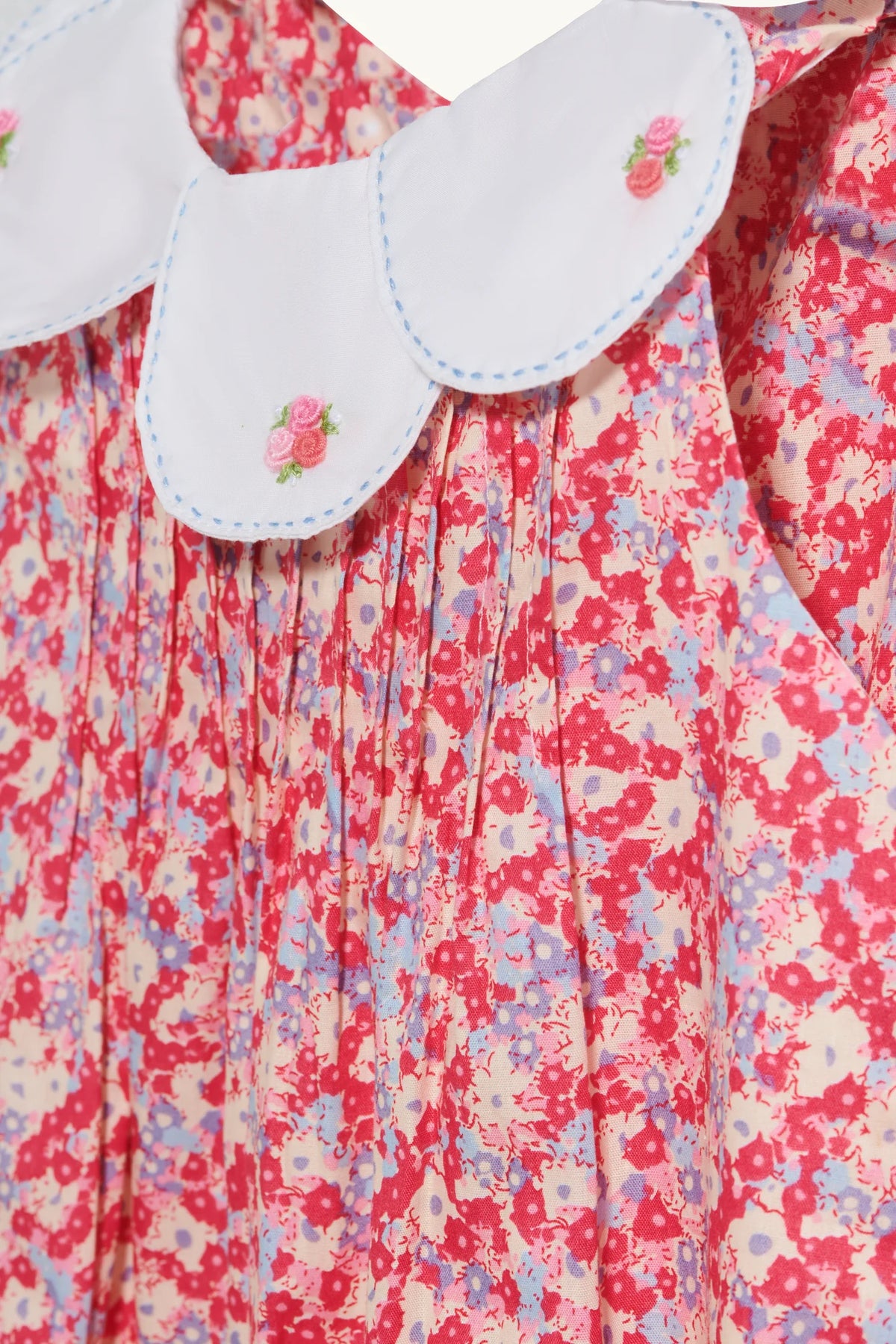 Rosette romper in Cherry Red hand-embroidered cotton lawn